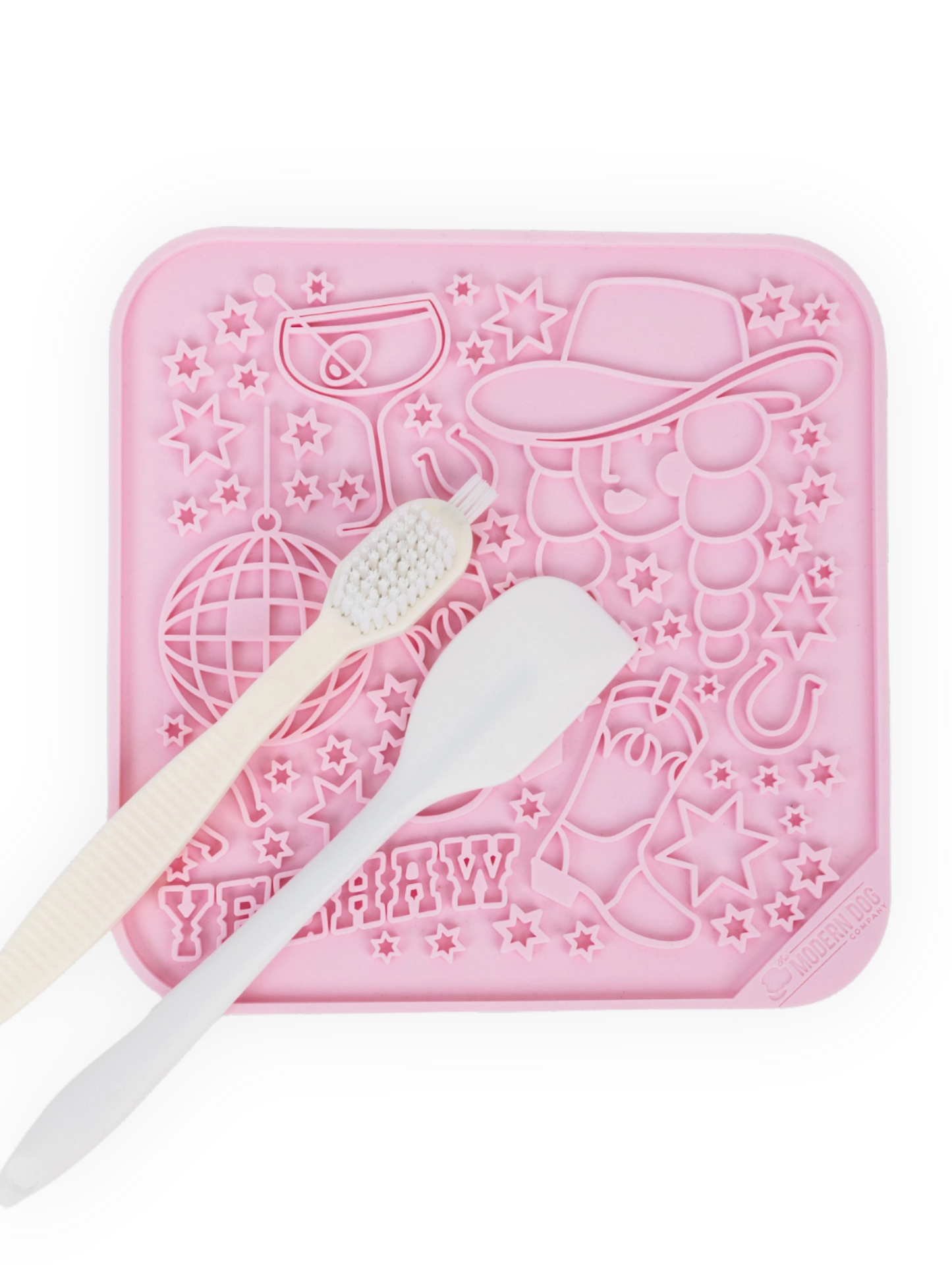 8x8 pink Western dog lick mat with cowboy hat design, includes spatula and cleaning brush – calming enrichment mat for dogs