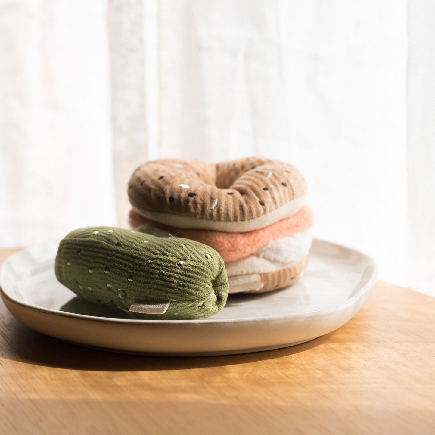 Lambwolf Collective bagel and pickle dog toy set with snuffle treat slots and squeaky pickle