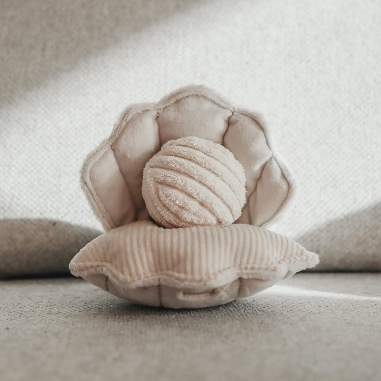 Lambwolf Collective Oyster Pop dog toy with squeaky shell, crinkly texture, and removable squeaky ball treat holder