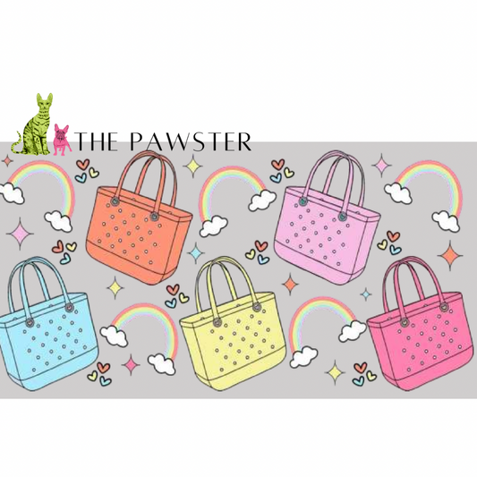 UV DTF cup wrap with colorful tote bags, rainbows, clouds, hearts, and sparkles on a grey background