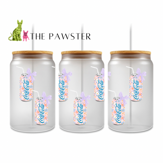 UV DTF wrap showing a pastel floral soda can with a lavender bow and straw on a clear background cup