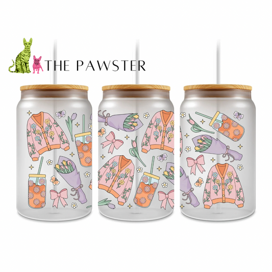 UV DTF cup wrap with pastel floral cardigans, tulip bouquets, pink bows, and orange daisy tumblers