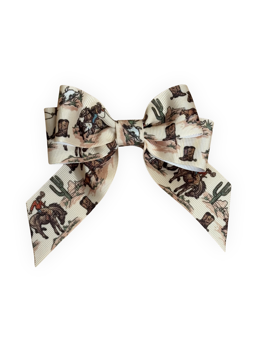 Handmade western cowboy print dog hair bow with alligator clip from The Pawster Rodeo Luxe collection