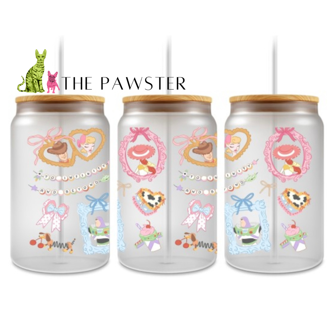 Pastel cowboy and cowgirl UV DTF wrap with hearts, bows, and western-inspired details on can glass cup.