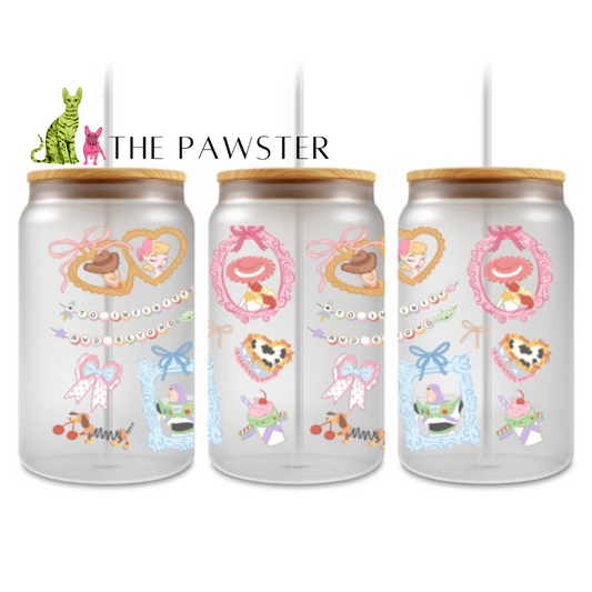 Pastel cowboy and cowgirl UV DTF wrap with hearts, bows, and western-inspired details on can glass cup.