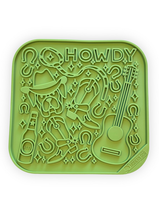 Green western-themed 8x8 dog lick mat with cowboy boots, hat, and guitar – enrichment feeder for dogs