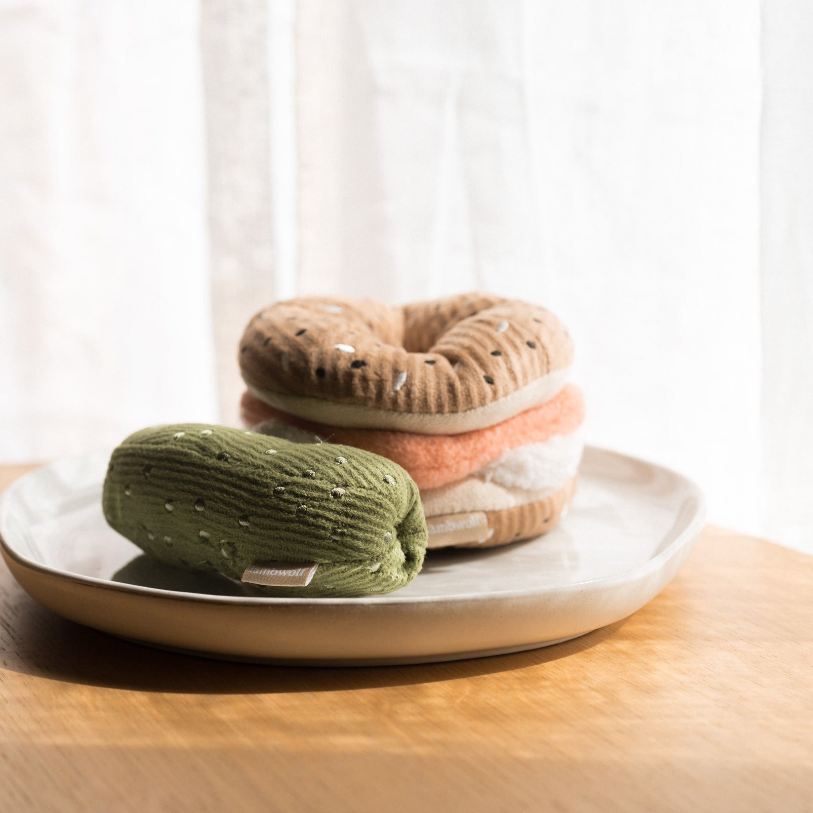 Lambwolf Collective bagel and pickle dog toy set with snuffle treat slots and squeaky pickle