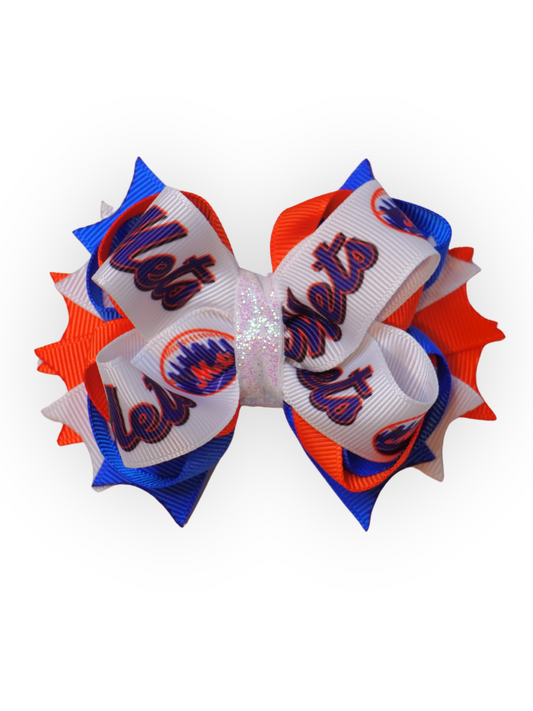 Handmade Mets-inspired bow with orange, blue, and white layered ribbon and glitter center for dogs, kids, and adults