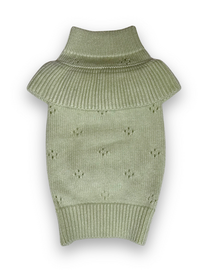 A green, sleeveless knitted pet sweater with a high neck and ruffle trim.
